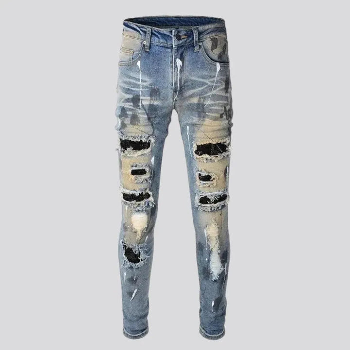 Whiskered crystal-patch jeans